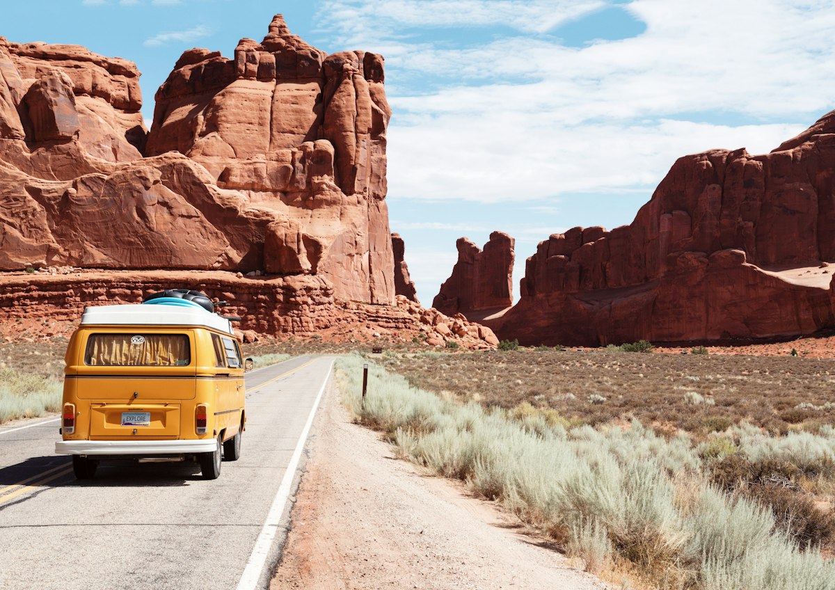 Scenic two-lane highway winding through picturesque landscape during a road trip