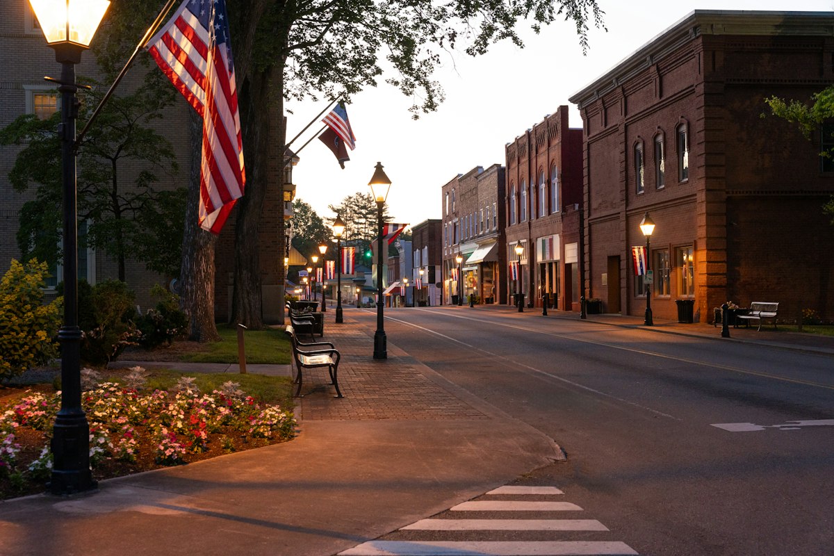 Picturesque historic small town street with autumn foliage and classic architecture
