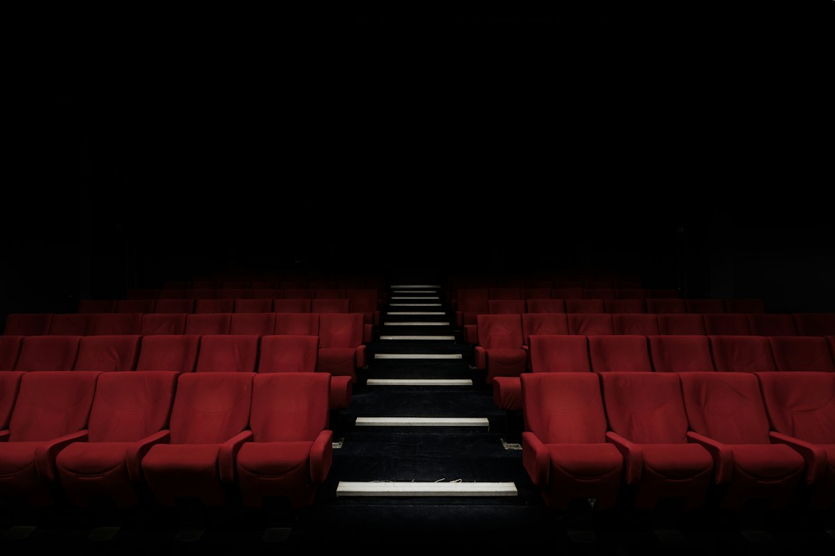 Cinema theater seats and screen illustrating cinematic production design